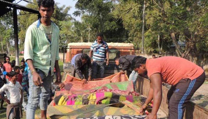 (representational) Villagers arranging the bodies of victims who died after allegedly drinking toxic liquor, in Assams Golaghat district on Feb 22, 2019. — AFP