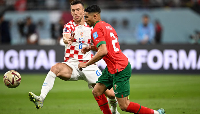Croatia’s midfielder #04 Ivan Perisic (L) fights for the ball with Morocco’s midfielder #07 Hakim Ziyech during the Qatar 2022 World Cup third place play-off football match between Croatia and Morocco at Khalifa International Stadium in Doha on December 17, 2022. — AFP