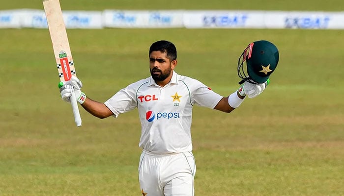 Pakistans captain Babar Azam celebrates after scoring a century (100 runs) during the second day of the first cricket Test match between Sri Lanka and Pakistan at the Galle International Cricket Stadium in Galle on July 17, 2022. — AFP