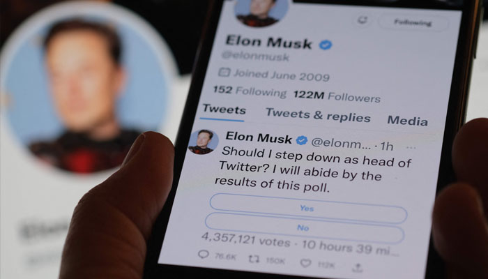 This photo illustration taken on December 18, 2022 in Los Angeles shows a phone displaying Elon Musk´s Twitter page where he is conducting a survey about his future as the head of the company. — AFP/File