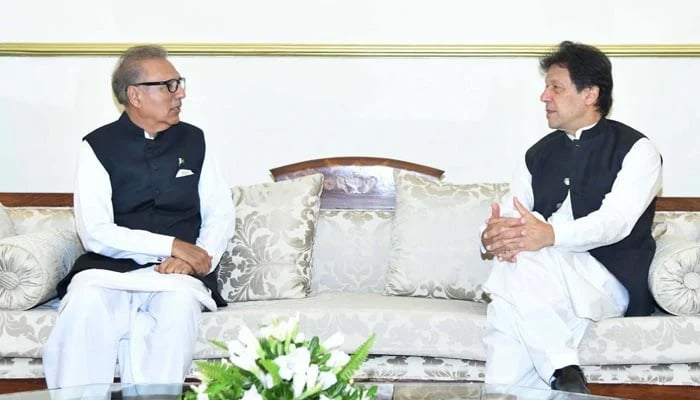 President Arif Alvi (L) meeting with Pakistan Tehreek-e-Insaf Chairman and former prime minister Imran Khan in this undated picture. — Twitter/File
