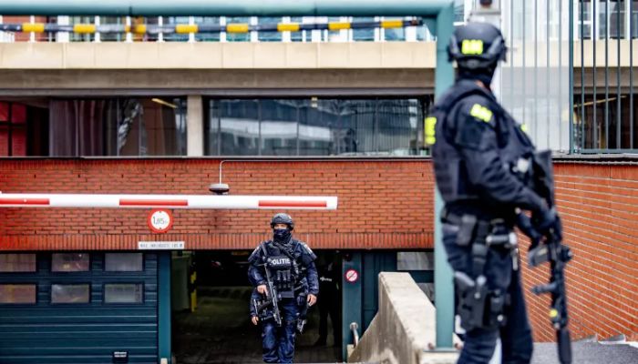 Police officers stand guard at the 2021 extradition hearing in the Netherlands of Tse Chi Lop, a Canadian of Chinese origin, who is alleged to be one of the most wanted drug criminals in the world.— AFP