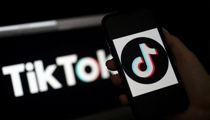 The TikTok logo is displayed on the screen of an iPhone on April 13, 2020, in Arlington, Virginia.— AFP