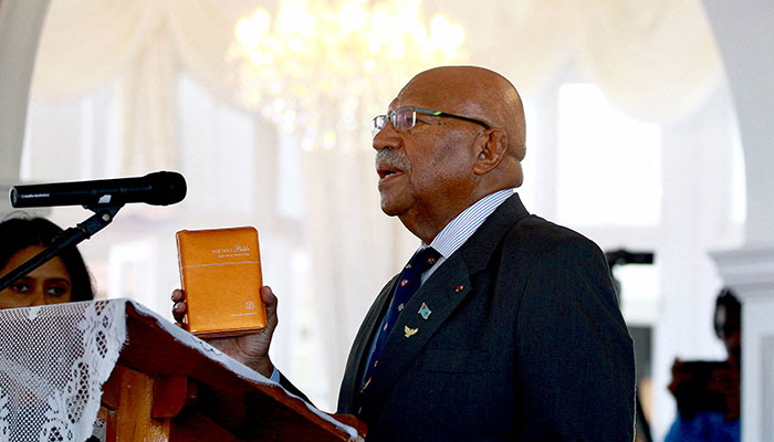 Fiji´s Prime Minister Sitiveni Rabuka takes the oath of office during a ceremony in Fiji´s capital city Suva on December 24, 2022. — AFP