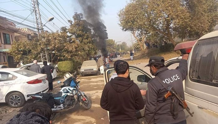 People gathered after a suicide car bomb blast in I-10 sector, Islamabad. — Twitter/File