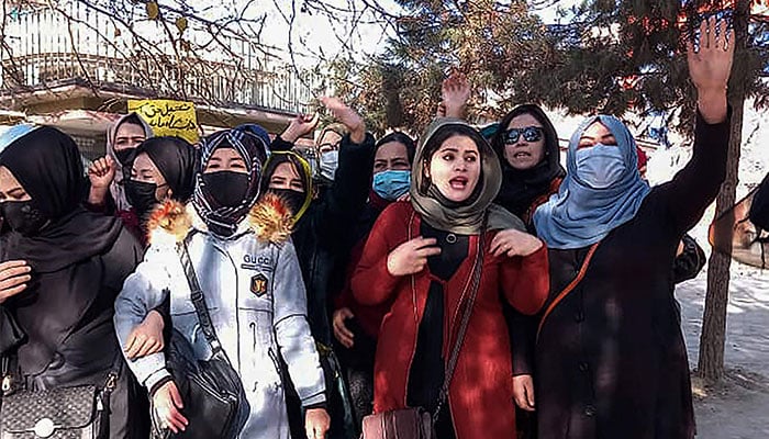 Afghan women chant slogans to protest against the ban on university education for women, in Kabul on December 22, 2022. — AFP