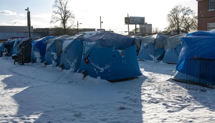 A row of tents is seen in a tent encampment established for homeless people, on December 24, 2022 in Louisville, Kentucky.— AFP