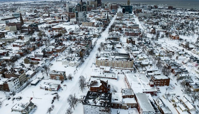 An aerial view of a city covered with layers of snow in the US. — AFP/File