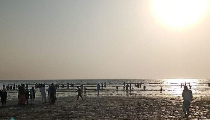 Citizens enjoy the sunset at Seaview in Karachi on December 31, 2022. — Facebook/W-11