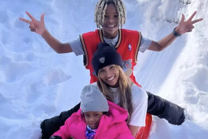 Ciara spotted sledding and dancing in the snow with kids during winter getaway