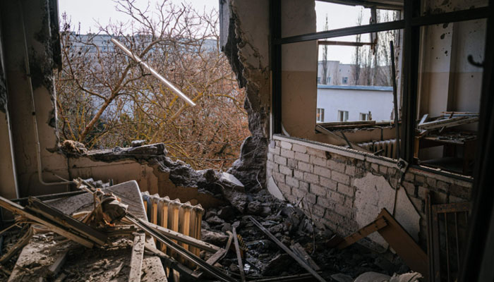 This photograph taken on January 1, 2023, shows an inside view of a damaged room of the regional Children’s Hospital after a Russian missile strike in the southern city of Kherson. — AFP