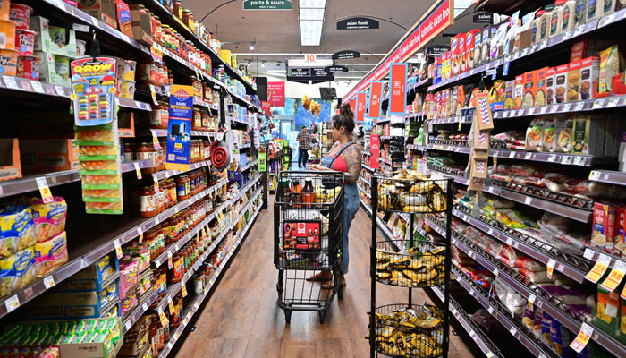 A woman shops for groceries at a supermarket in Monterey Park, California on October 19, 2022. — AFP