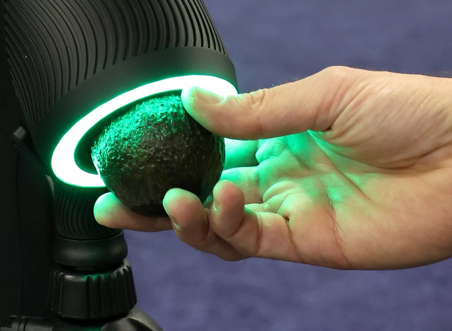 The OneThird Ripeness Checker is demonstrated checking an avocado during a press event at CES 2023.— AFP