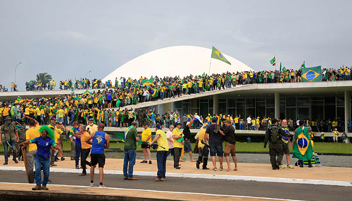 Supporters of Brazilian former President Jair Bolsonaro invade the National Congress in Brasilia on January 8, 2023. — AFP