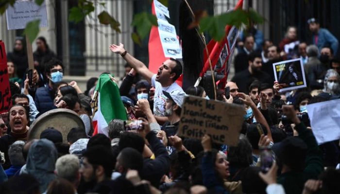 People take part in a demonstration in support of Iranian protesters in Paris, on September 25, 2022.— AFP