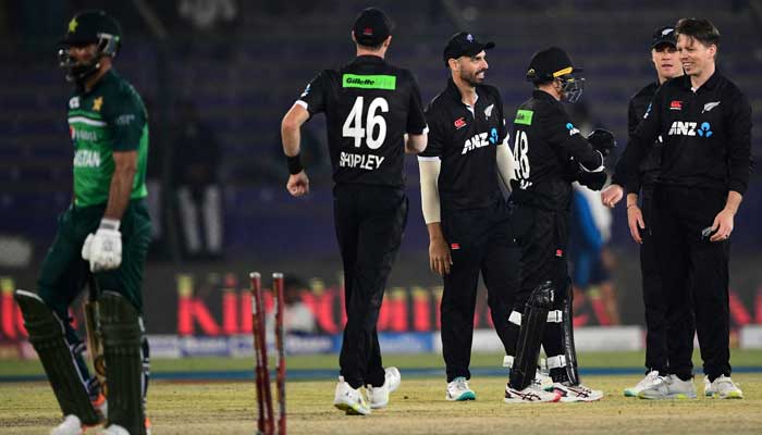 New Zealands players celebrate after the dismissal of Pakistans Fakhar Zaman (left) during the first one-day international (ODI) cricket match between Pakistan and New Zealand at the National Stadium in Karachi on January 9, 2023. — AFP