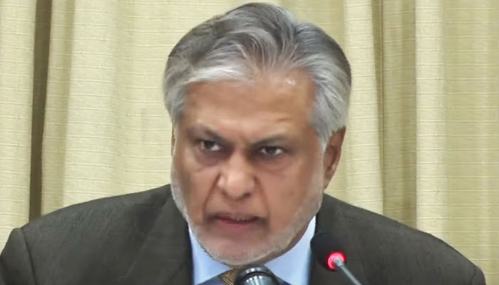Federal Minister for Finance and Revenue Ishaq Dar addressing a news conference alongside Prime Minister Shehbaz Sharif and other federal cabinet members in Islamabad on January 11, 2023. — YouTube Screengrab via PTV News