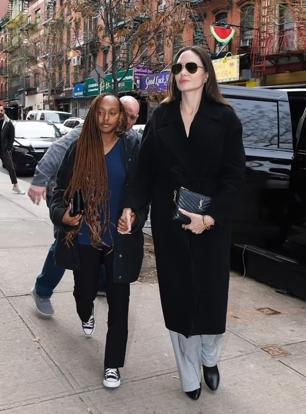 Angelina Jolie rocks black trench coat as she goes shopping with daughter Zahara