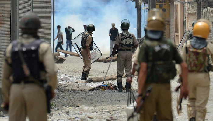 Protestors in Kashmir clash with armed Indian policemen in Srinagar in February 2020. — AFP
