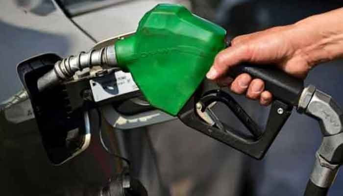 A representational image of a man filling a cars fuel tank. — AFP/File