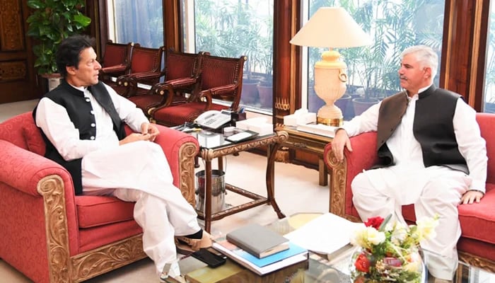 Khyber Pakhtunkhwa Chief Minister Mahmood Khan (right) calls on PTI Chairman Imran Khan at the Prime Ministers Office in Islamabad on July 8, 2019. — Radio Pakistan