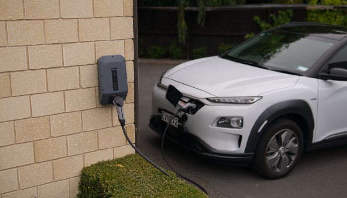 Black charger plugged into an electric car.— Pexels.  Wyoming electric vehicle ban by 2035 urged 1031613 3189316 ev updates
