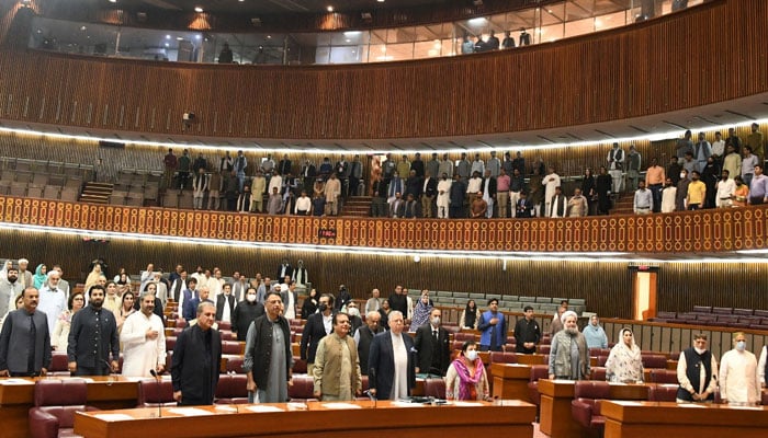 Pakistan Tehreek-e-Insaf leaders can be seen standing in respect of the national anthem being played in the National Assembly in this undated image.— Twitter/@NAofPakistan  NA speaker approves resignations of 35 PTI MNAs 1031626 4729354 NA session   Twitter NA updates