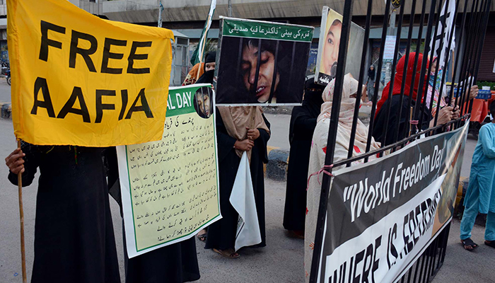 Members of the Aafia Movement are holding a protest demonstration against the detention of Dr Aafia Siddiqui by US authorities on the occasion of Iqbal Day held at Karachi press club on November 09, 2022. — PPI