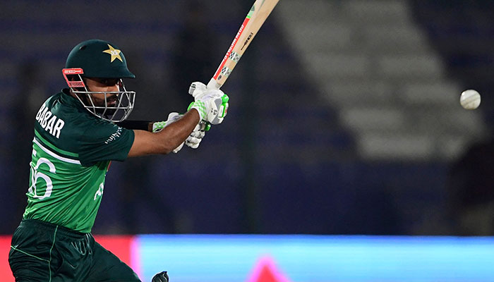 Pakistan´s captain Babar Azam plays a shot during the first one-day international (ODI) cricket match between Pakistan and New Zealand at the National Stadium in Karachi on January 9, 2023. — AFP