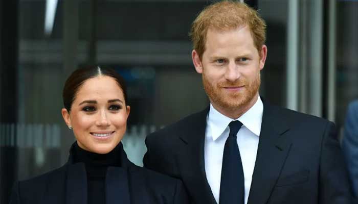 Meghan Markle keeping her head down to let Prince Harry take center stage