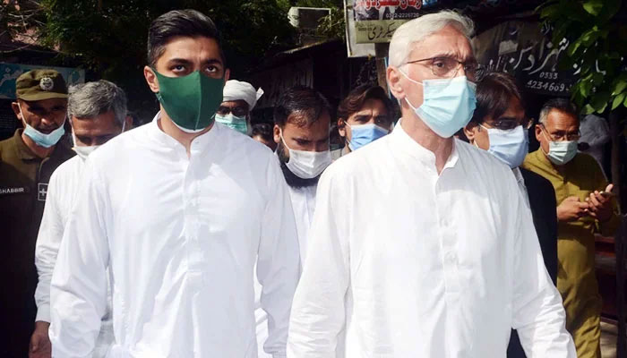Estranged PTI leader Jahangir Tareen (right) and his son arrive for a case hearing at a judicial complex in Lahore. — PPI/File