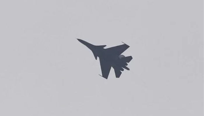 An Indian Air Force fighter jet flies over Srinagar on September 23, 2021. — AFP