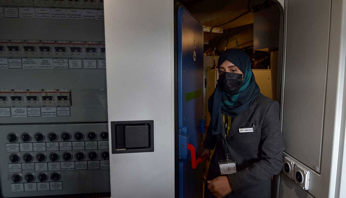 Raneem Azzouz enters the drivers cabin of the high-speed train. — AFP