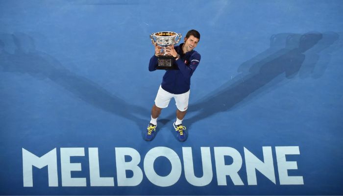 Novak Djokovic holds the Norman Brookes Challenge Cup for a record-equalling sixth time after beating Andy Murray in 2016.— AFP/file