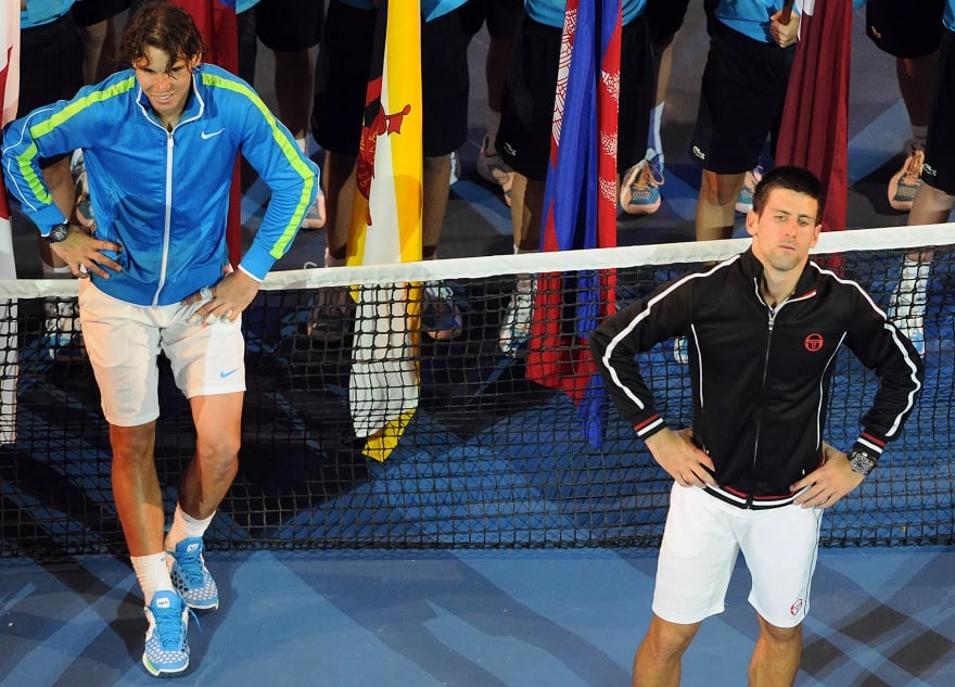 An exhausted Novak Djokovic (right) and Rafael Nadal wait for the trophy presentations after their marathon 5hr 53min 2012 final. — AFP/file
