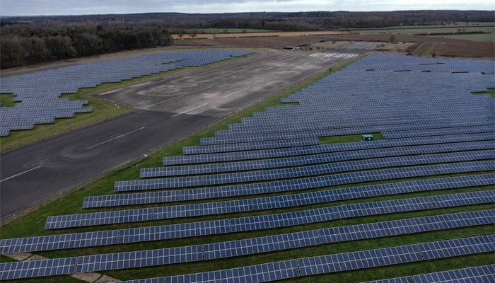 An aerial view shows the photovoltaic (PV) solar panels making up RAF Coltishall Solar Park, near Lamas, north of Norwich in Eastern England. — AFP/File
