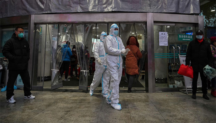 Medical staff members, wearing protective clothing at the Wuhan Red Cross Hospital in Wuhan. — AFP/File
