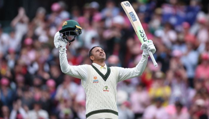 Australiaâ€™s Usman Khawaja celebrates reaching his century (100 runs) during day two of the third cricket Test match between Australia and South Africa at the Sydney Cricket Ground (SCG) in Sydney on January 5, 2023.— AFP