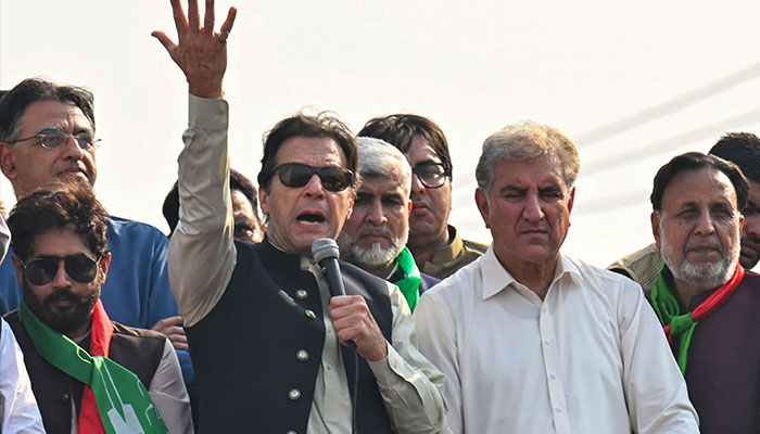 Former Pakistan prime minister Imran Khan (C) addresses his supporters during an anti-government long march towards Islamabad to demand early elections, in Lahore on October 29, 2022. — AFP/File