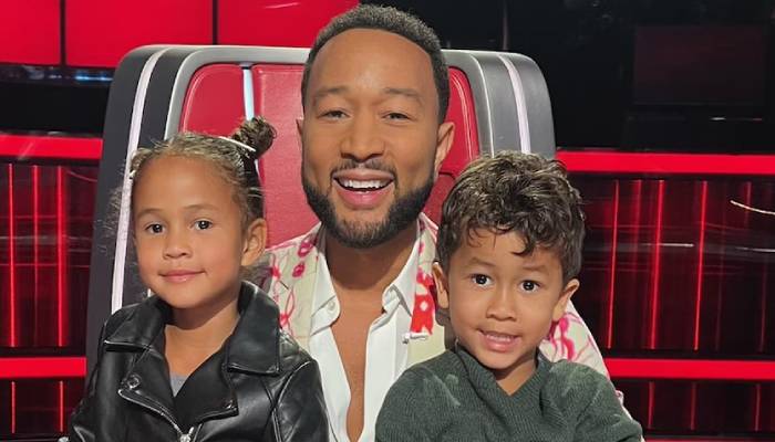 John Legend explains how his older children have reacted to the newborn