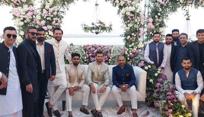 Shaheen Afridi poses with his father-in-law Shahid Afridi and fellow cricketers including Babar Azam and Sarfaraz Ahamed during the his Nikah reception in Karachi on February 3, 2023. — Photo by author