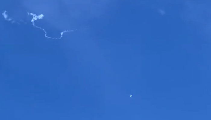 This still image taken from a cellphone video by Haley Walsh in Myrtle Beach, South Carolina, shows an alleged Chinese surveillance balloon after it was shot down on February 4, 2023. AFP