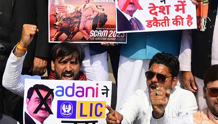 India´s Congress party activists take part in a nationwide protest outside the Life Insurance Corporation (LIC) office in Prayagraj on February 6, 2023. — AFP