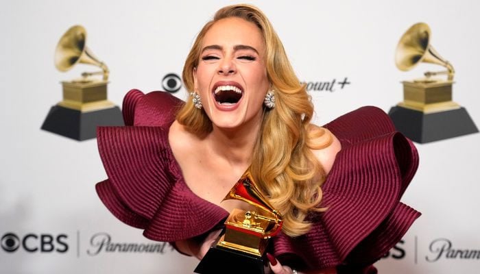 Adele dedicates her Grammy award for best pop solo performance to son