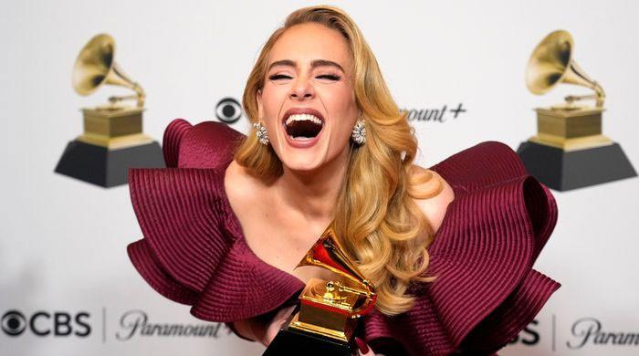 Adele dedicates her Grammy award for best pop solo performance to son