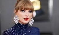 Taylor Swift calms down Grammy photographer after ‘angsty’ snipe at publicist