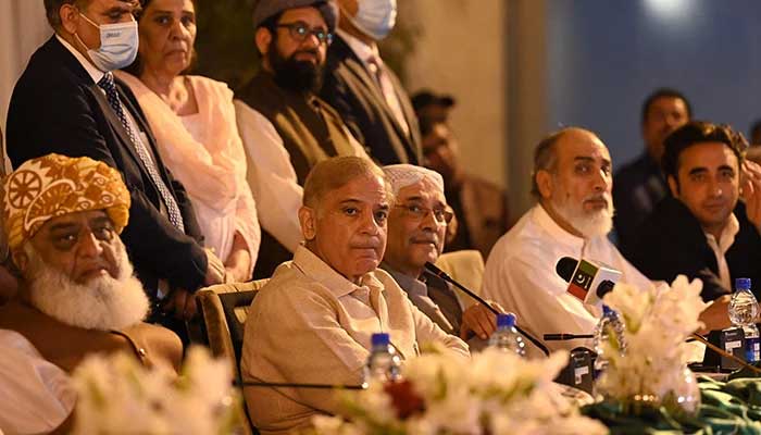 JUI-Fs Fazlur Rehman (from left to right), Prime Minister Shehbaz Sharif and PPPs Asif Ali Zardari speak during a press conference in Islamabad, on March 28, 2022. — AFP/ file