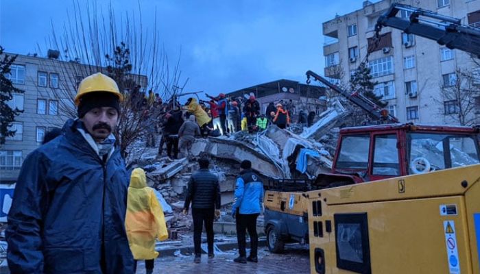 Rescue workers and volunteers search for survivors in the rubble of a collapsed building after the earthquake, in Sanliurfa, Turkey on February 6, 2023. — AFP