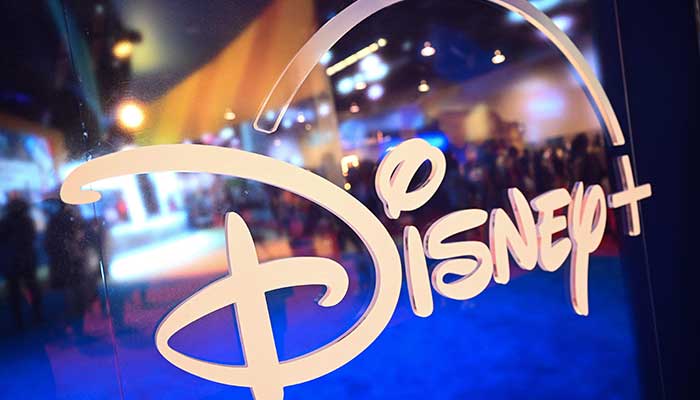 In this file photo taken on September 09, 2022 fans are reflected in Disney+ logo during the Walt Disney D23 Expo in Anaheim, California. — AFP/File