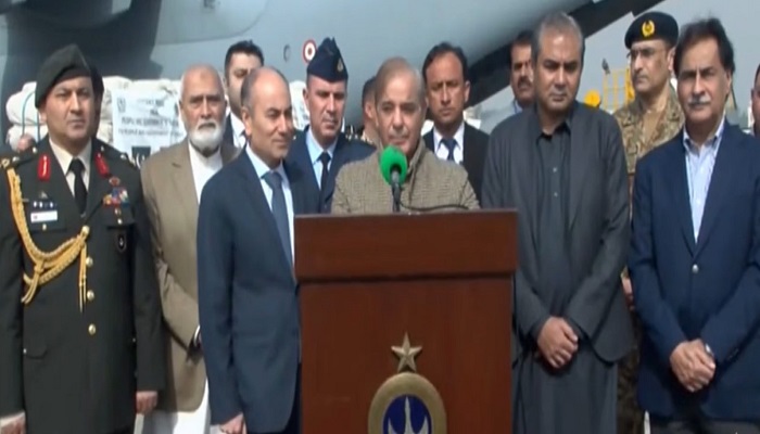 Prime Minister Shehbaz Sharif speaks at an airport in Lahore on Friday. — Screengrab/ PTV